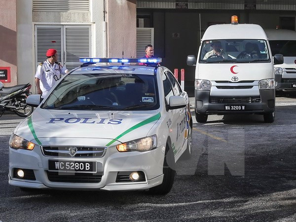 Xe cảnh sát và xe cứu thương mang thi thể ông Kim Jong-nam rời bệnh viện ở Putrajaya, Malaysia ngày 15/2. (Nguồn: EPA/TTXVN)