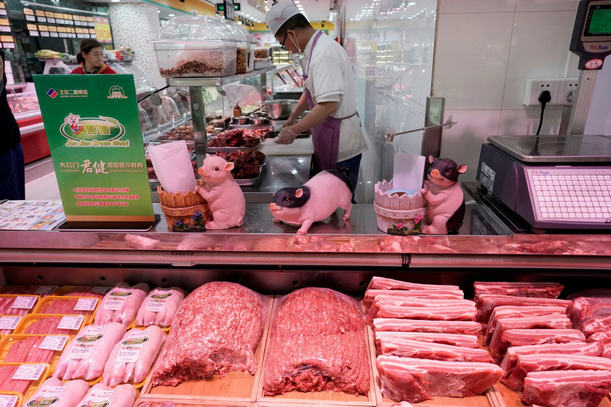Lần đầu tiên sau hơn 1 năm, “cơn sốt” thịt lợn Trung Quốc hạ nhiệt - Ảnh 1.