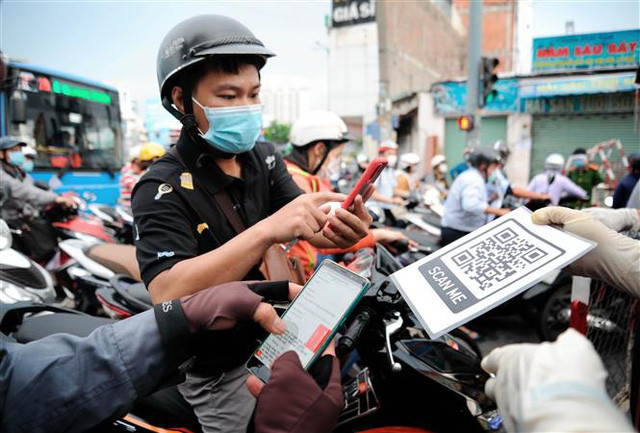 Quy trình khai báo y tế điện tử cho người dân ra, vào quận Gò Vấp, TP Hồ Chí Minh - Ảnh 1.