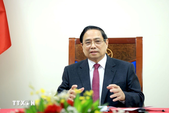 ttxvn-thu-tuong-pham-minh-chinh-dien-dam-voi-thu-tuong-singapore-1002-3.jpg