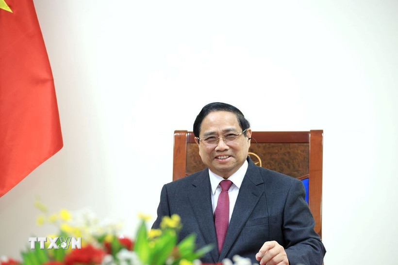 Thủ tướng Phạm Minh Chính điện đàm với Thủ tướng Singapore Lawrence Wong. (Ảnh: Tuấn Anh/TTXVN)