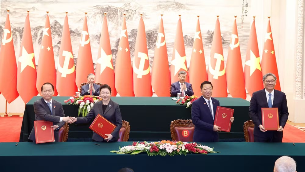 vna-potal-tong-bi-thu-chu-tich-nuoc-to-lam-va-tong-bi-thu-chu-tich-nuoc-tap-can-binh-chung-kien-le-ky-cac-van-kien-hop-tac-giua-hai-nuoc-8702438-9984.jpg