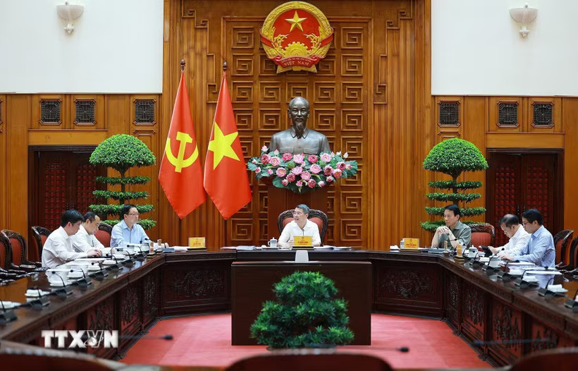 Thủ tướng Lê Minh Hưng chủ trì làm việc với lãnh đạo Bộ Công an và Bộ Khoa học và Công nghệ về xây dựng khung kiến trúc tổng thể quốc gia số. (Ảnh: Dương Giang/TTXVN)