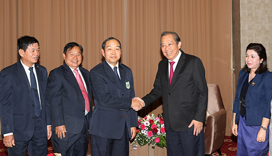 Phó Thủ tướng Trương Hòa Bình gặp Chánh án TANDTC Lào Khampha Sengdara