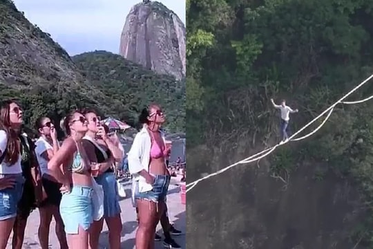 Du khách nín thở xem 'kẻ liều mạng' đi trên dây giữa 2 đỉnh núi cao chót vót