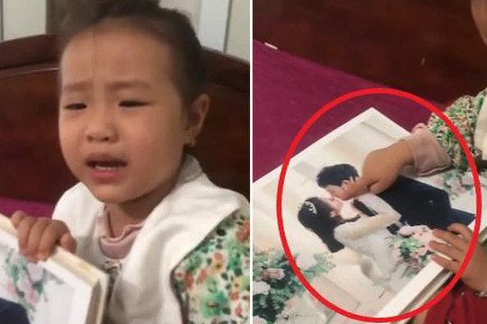 Vừa xem ảnh cưới bố mẹ bé gái vừa khóc nức nở tiết lộ lý do 'dở khóc dở cười'