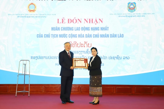 TANDTC Việt Nam đón nhận Huân chương Lao động hạng Nhất của Chủ tịch nước CHDCND Lào